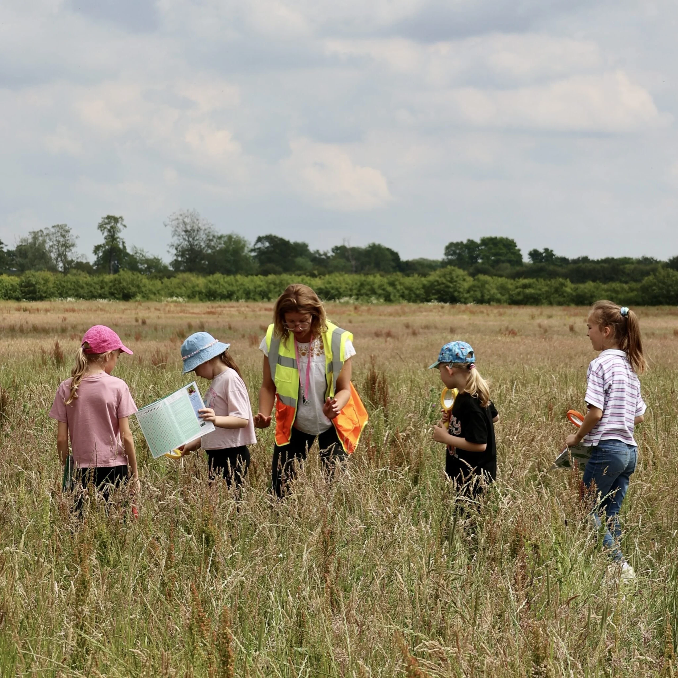 children with a guide exploring the landscape at wilder doddington