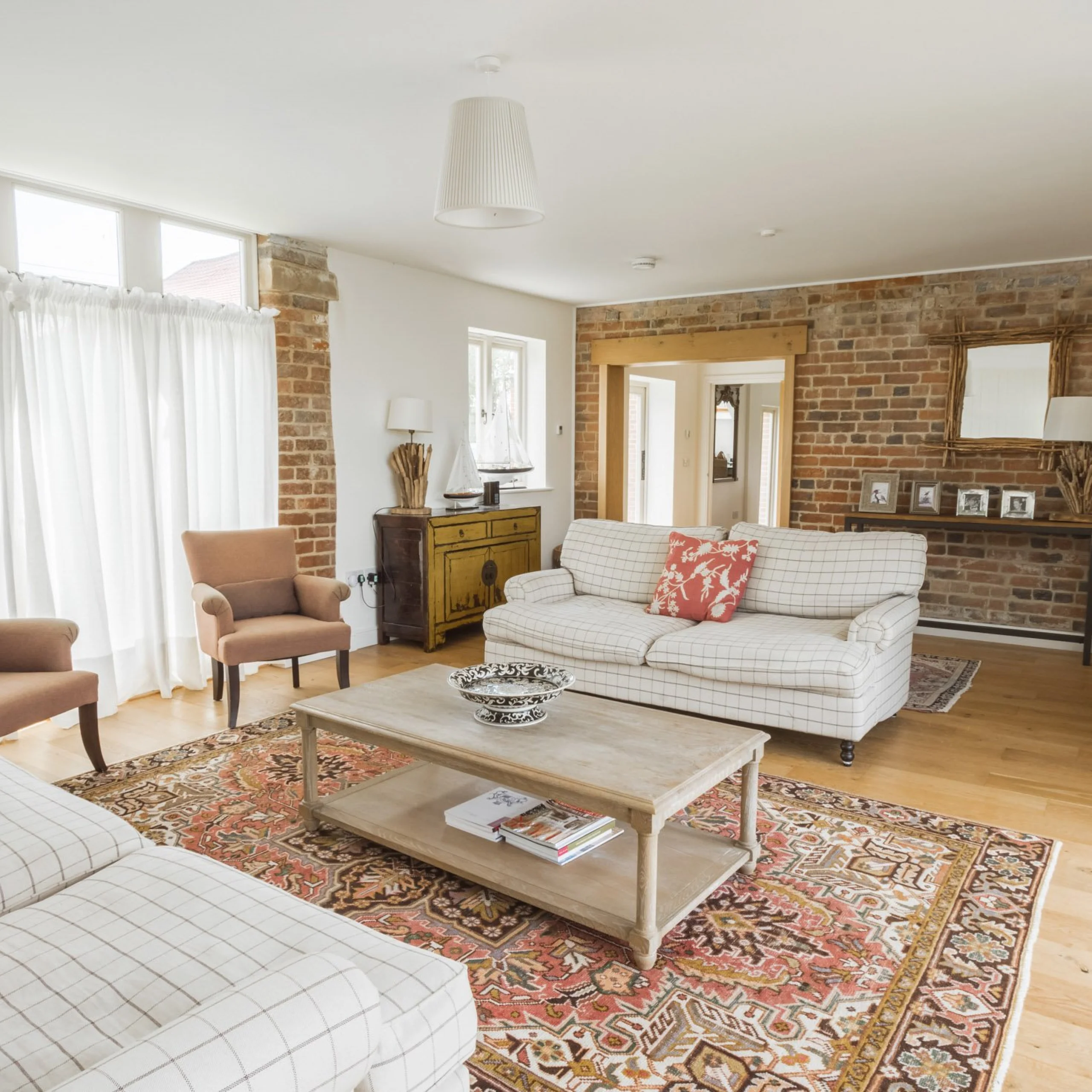 a living room interior with sofas at the shakespeare cottage at doddington hall
