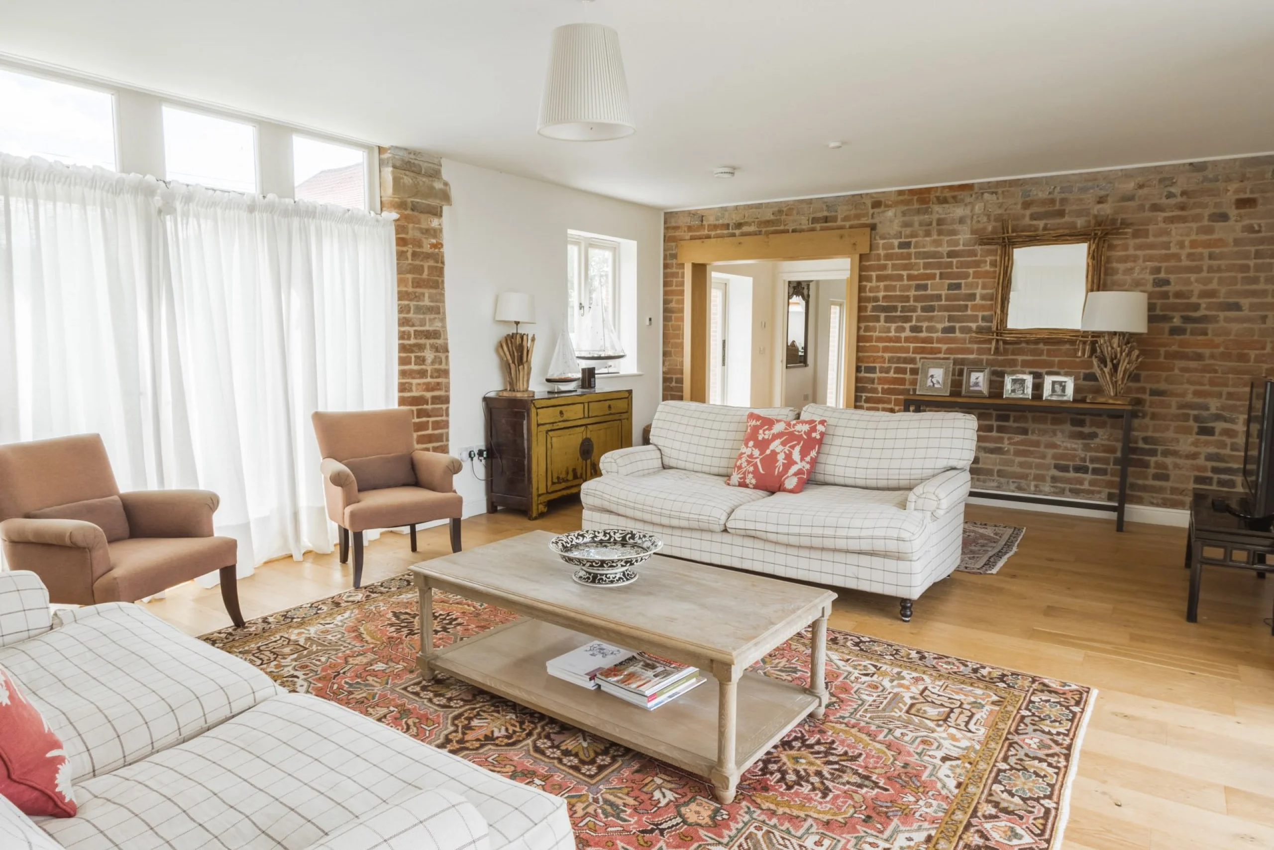 a living room interior with sofas at the shakespeare cottage at doddington hall
