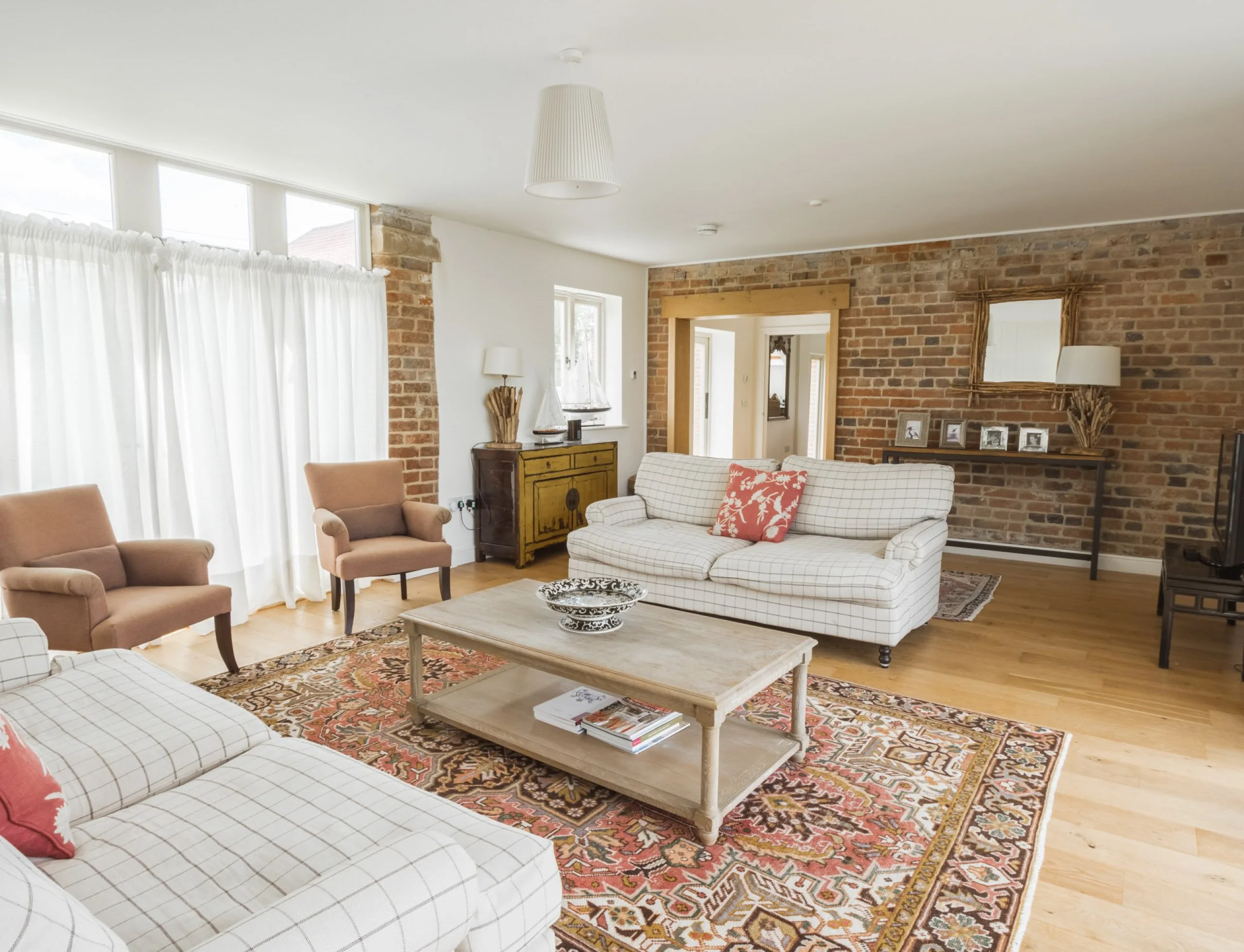 a living room interior with sofas at the shakespeare cottage at doddington hall