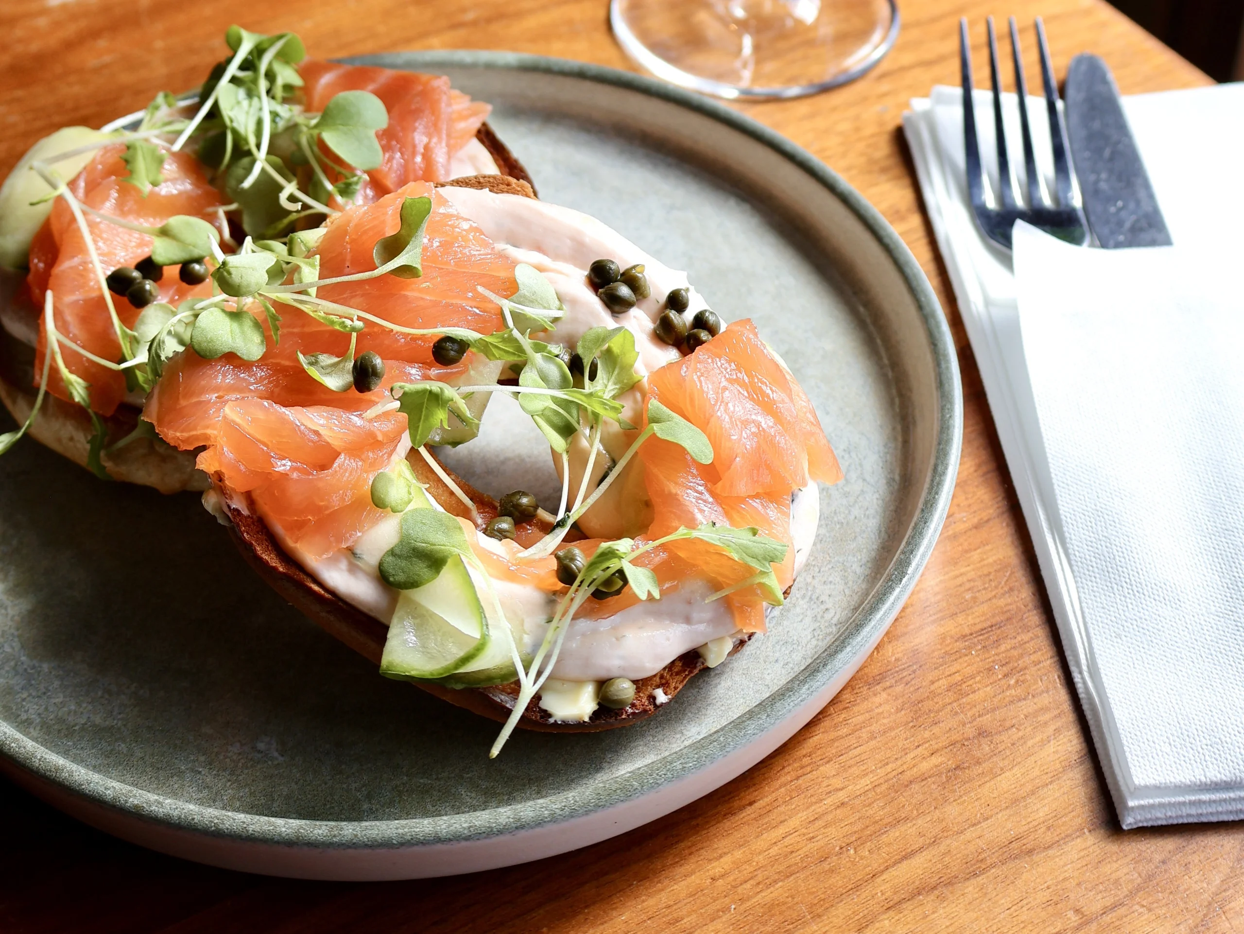 a seeded bagel with cream cheese and smoked salmon from the farm shop cafe at doddington hall
