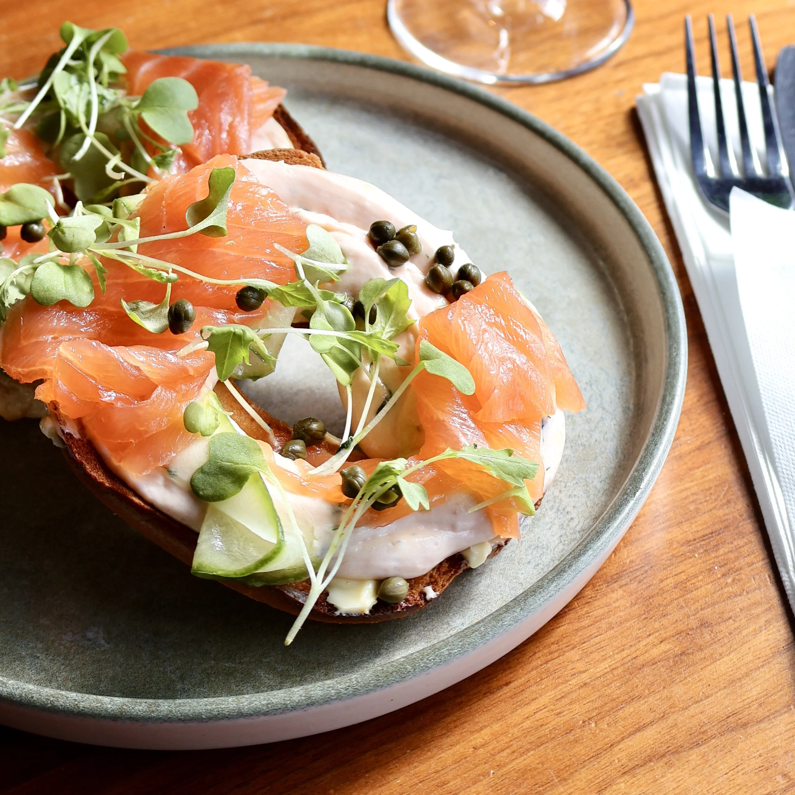 a seeded bagel with cream cheese and smoked salmon from the farm shop cafe at doddington hall