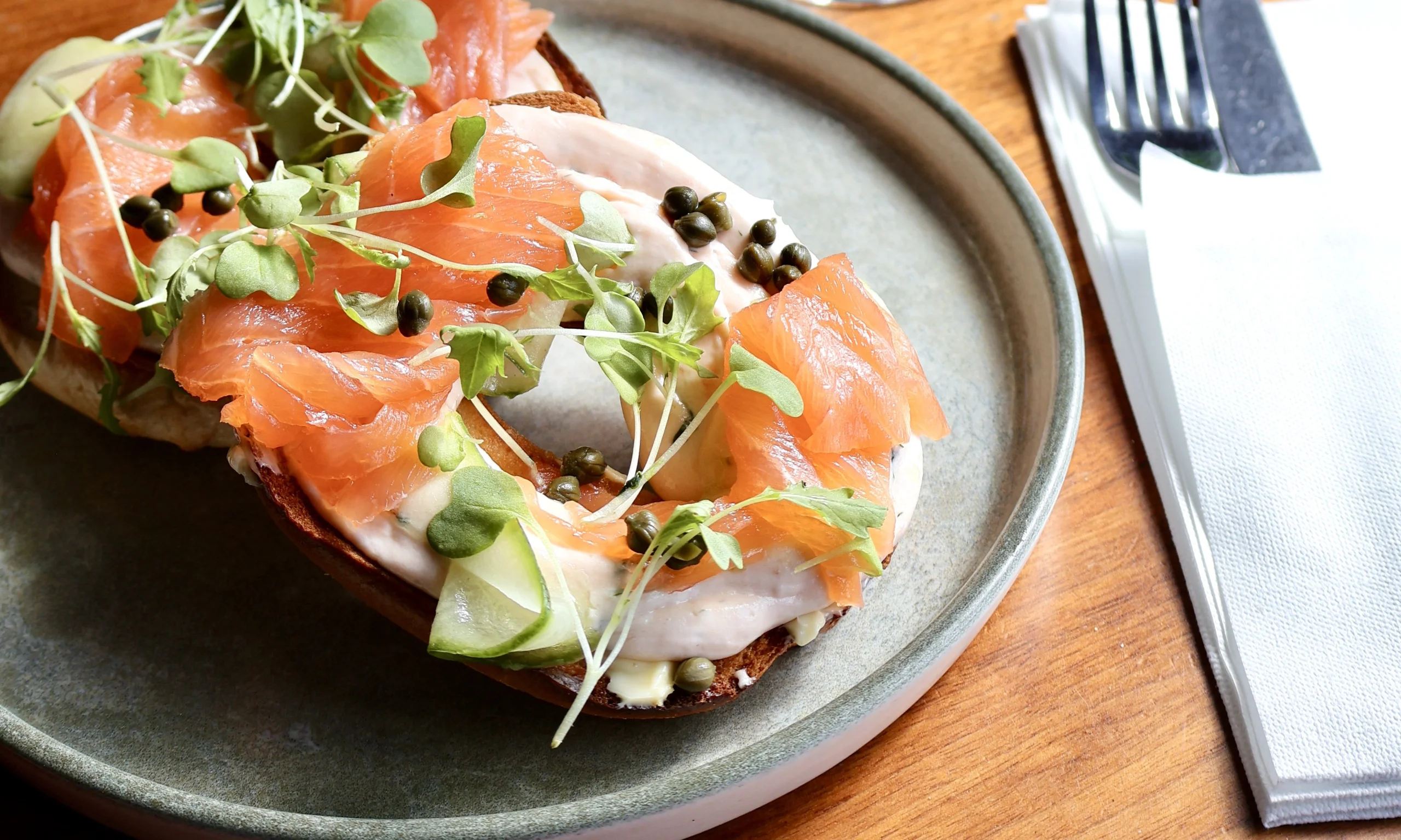 a seeded bagel with cream cheese and smoked salmon from the farm shop cafe at doddington hall