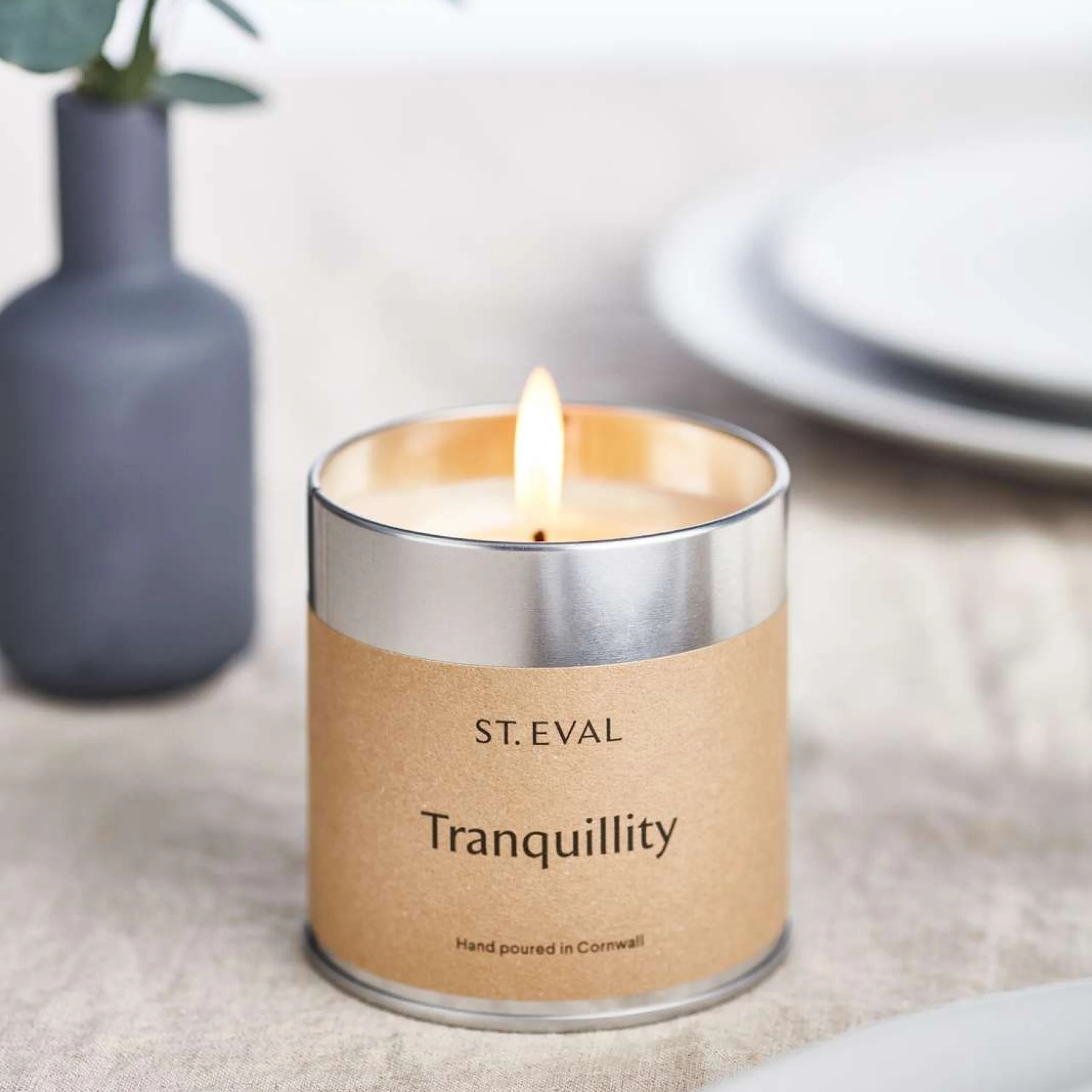 a st. eval candle on a table from the doddington home shop at doddington hall