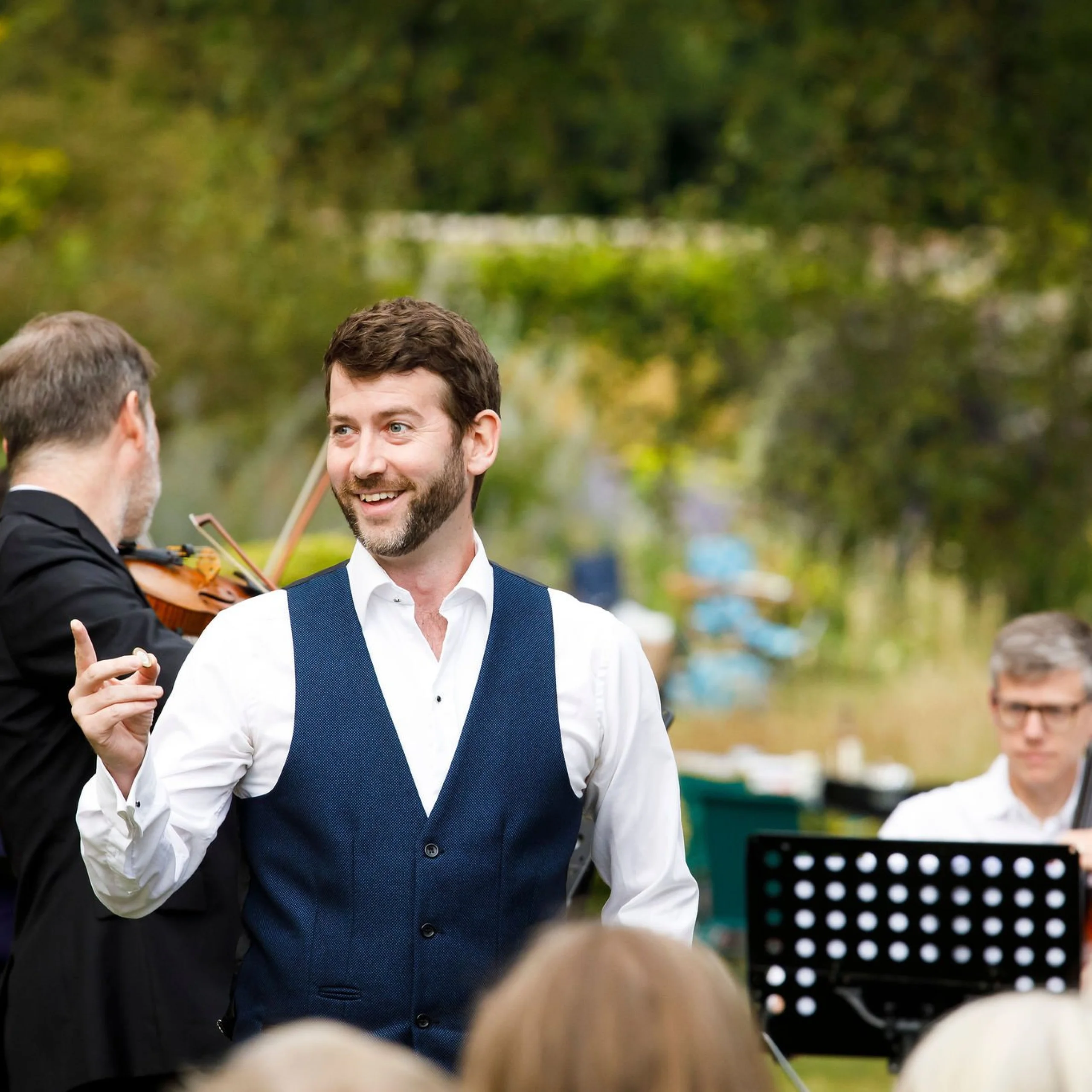 male opera singer smiling at doddington hall